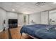 Spacious bedroom with modern decor, wood floors, and lots of natural light at 387 Nickajack Se Rd, Mableton, GA 30126