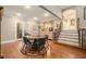 Cozy dining room features hardwood floors and decorative glass doors, creating a warm and inviting atmosphere at 387 Nickajack Se Rd, Mableton, GA 30126