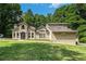 Stunning home with a manicured lawn and stately curb appeal at 387 Nickajack Se Rd, Mableton, GA 30126