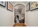 Hallway with hardwood floors and elegant archways, providing seamless flow throughout the home at 387 Nickajack Se Rd, Mableton, GA 30126