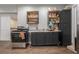 This modern kitchen boasts stainless steel appliances, granite counters, and dark cabinetry at 387 Nickajack Se Rd, Mableton, GA 30126