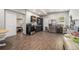 Open-concept living space features wood flooring, updated kitchen area, and access to a bedroom at 387 Nickajack Se Rd, Mableton, GA 30126