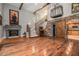 Stylish living room featuring a fireplace, staircase, and hardwood floors at 387 Nickajack Se Rd, Mableton, GA 30126