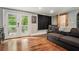 Cozy living room with hardwood floors, gray walls and access to outdoor balcony at 387 Nickajack Se Rd, Mableton, GA 30126