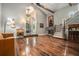 Open living room featuring hardwood floors, fireplace, and staircase at 387 Nickajack Se Rd, Mableton, GA 30126