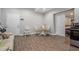 Cozy living room features wood flooring, a dining area, access to a bedroom, and lots of natural light at 387 Nickajack Se Rd, Mableton, GA 30126