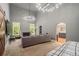 Spacious open-concept living area with a fireplace, high ceilings, and a modern chandelier at 387 Nickajack Se Rd, Mableton, GA 30126