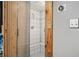 Private steam room featuring a built-in bench, tile and wooden door with glass panel at 387 Nickajack Se Rd, Mableton, GA 30126