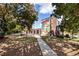 Outdoor area featuring a mural on a building with greenery and walking path at 4011 Chamblee Dunwoody Rd, Chamblee, GA 30341