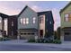 Charming two-story home with blue siding, brick accents, and a front-facing garage at 4011 Chamblee Dunwoody Rd, Chamblee, GA 30341