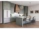 Modern kitchen featuring stainless steel appliances, pendant lighting, and a center island with seating at 4011 Chamblee Dunwoody Rd, Chamblee, GA 30341