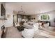 Bright and airy living room with hardwood floors, a fireplace, and an open floor plan at 4011 Chamblee Dunwoody Rd, Chamblee, GA 30341