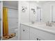 Bathroom with double sink vanity, decorative shower curtain and tile floors at 410 Crestbrook Ln, Dallas, GA 30157