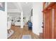 Bright foyer featuring hardwood floors, an open concept layout, and a striking view to the living room and kitchen at 410 Crestbrook Ln, Dallas, GA 30157