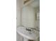 Close-up of a vintage sink and large mirror, a great bathroom remodel opportunity at 7117 Stonebrook Cv, Lithonia, GA 30058