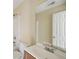 Bathroom with a single sink vanity and shower with tile surround at 7117 Stonebrook Cv, Lithonia, GA 30058