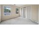 Bright bedroom with carpeted floor, closet, and natural light from windows at 7117 Stonebrook Cv, Lithonia, GA 30058