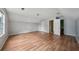 Expansive bonus room featuring hardwood floors and access to the bathroom at 7117 Stonebrook Cv, Lithonia, GA 30058