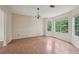 Open-concept dining area featuring ample light from three bay windows at 7117 Stonebrook Cv, Lithonia, GA 30058