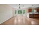 Open-concept dining area featuring ample light from three bay windows at 7117 Stonebrook Cv, Lithonia, GA 30058