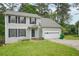 Charming two-story home featuring a classic colonial design and an attached two-car garage at 7117 Stonebrook Cv, Lithonia, GA 30058