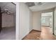 Hallway leading to rooms with tiled floor and neutral paint at 7117 Stonebrook Cv, Lithonia, GA 30058