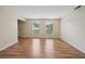 Bright living room with laminate flooring and natural light from two large windows at 7117 Stonebrook Cv, Lithonia, GA 30058