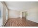 Spacious living room with wood laminate flooring and bright natural light from the windows at 7117 Stonebrook Cv, Lithonia, GA 30058