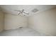 Simple room with a ceiling fan and standard tile flooring, offering a basic living space at 7117 Stonebrook Cv, Lithonia, GA 30058
