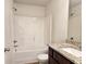 Full bathroom with tub-shower combination, granite vanity, and white fixtures at 1529 Iris Walk, Jonesboro, GA 30238