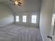 Spacious bedroom with ample natural light from three large windows at 1529 Iris Walk, Jonesboro, GA 30238