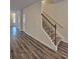 Hallway view featuring hardwood floors and a staircase at 1529 Iris Walk, Jonesboro, GA 30238