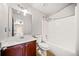 Bathroom with a tiled shower, wood vanity, and mirror at 1657 Preserve Park Dr, Loganville, GA 30052