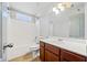 Bathroom featuring a white vanity, a mirror, and a shower over tub at 1657 Preserve Park Dr, Loganville, GA 30052