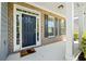 Inviting front entryway featuring a classic door with sidelights and a brick facade at 1657 Preserve Park Dr, Loganville, GA 30052