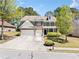 Charming two-story home with a well-manicured lawn and a spacious driveway, inviting curb appeal at 1657 Preserve Park Dr, Loganville, GA 30052