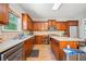 Well-equipped kitchen featuring stainless steel appliances, granite countertops, and ample cabinetry at 1657 Preserve Park Dr, Loganville, GA 30052