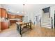 Open-concept kitchen featuring an island, hardwood floors, stainless steel appliances, and ample counter space at 1657 Preserve Park Dr, Loganville, GA 30052