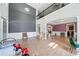 Spacious living room with high ceilings, hardwood floors, and ample natural light at 1657 Preserve Park Dr, Loganville, GA 30052