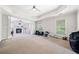 Spacious main bedroom with a fireplace, tray ceilings, and carpet flooring at 1657 Preserve Park Dr, Loganville, GA 30052