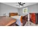 Comfortable bedroom with wood furnishings and a neutral color scheme at 1660 Rose Garden Ln, Loganville, GA 30052