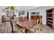 Open concept dining area connects to living room, with wood table and chairs at 1660 Rose Garden Ln, Loganville, GA 30052