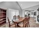 The dining area features classic wood furniture and flows into the kitchen at 1660 Rose Garden Ln, Loganville, GA 30052