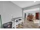 Eat-in kitchen with counter seating and view into adjacent dining room at 1660 Rose Garden Ln, Loganville, GA 30052
