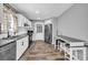 Modern kitchen with white cabinetry, stainless steel appliances, and breakfast bar at 1660 Rose Garden Ln, Loganville, GA 30052