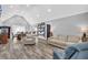 Bright open-concept living room features high ceilings and wood-look floors at 1660 Rose Garden Ln, Loganville, GA 30052