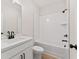 Bathroom boasting a modern vanity, a toilet, and a combined shower and bathtub, maximizing comfort and utility at 1995 Deco Dr, Kennesaw, GA 30144
