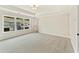 The bedroom boasts ample natural light, neutral paint, and plush carpet, creating a comfortable and inviting space at 1995 Deco Dr, Kennesaw, GA 30144