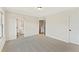 Spacious bedroom featuring neutral paint, plush carpeting, and ample natural light through a large window at 1995 Deco Dr, Kennesaw, GA 30144