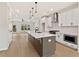 Modern kitchen boasts a large center island, stainless steel appliances, and sleek white cabinetry at 1995 Deco Dr, Kennesaw, GA 30144